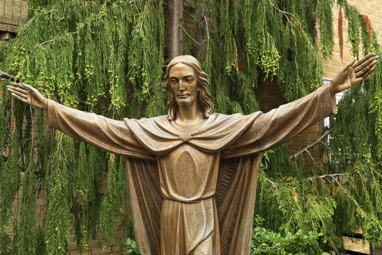 Bronze Statue of Jesus Christ in front of Church of Mary Queen of Haven in Brooklyn on July 13, 2013. Bronze Statue of Jesus Christ in front of Church of Mary Queen of Haven in Brooklyn on July 13, 2013.