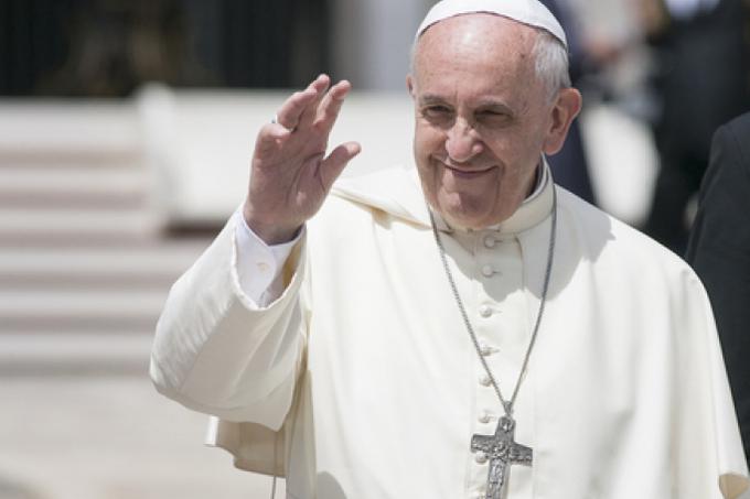 Pope Francis waves to pilgrims during a General Audience. Pope Francis waves to pilgrims during a General Audience.