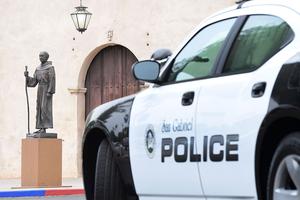 A police vehicle is seen parked near a statue of Father Junípero Serra in front of the San Gabriel Mission in San Gabriel, California, on June 21, 2020. A police vehicle is seen parked near a statue of Father Junípero Serra in front of the San Gabriel Mission in San Gabriel, California, on June 21, 2020.