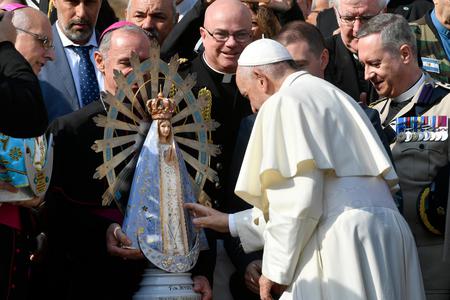 Pope Francis touches a statue of Our Lady of Lujan after the Wednesday general audience in St. Peter's Square on Oct. 30, 2019. Pope Francis touches a statue of Our Lady of Lujan after the Wednesday general audience in St. Peter's Square on Oct. 30, 2019.