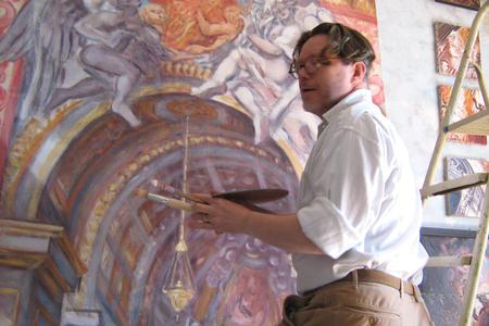 Philippe Casanova works on a painting. Philippe Casanova works on a painting.