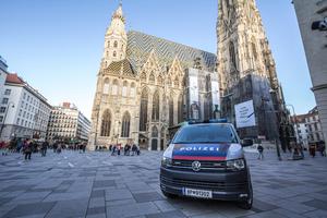 Austrian police car guarding St. Stephen's Cathedral in Vienna. Austrian police car guarding St. Stephen's Cathedral in Vienna.