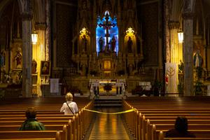 Church goers pray keeping social distancing at the St. Sanislaus Kostka Catholic Church  in the Greenpoint neighborhood of Brooklyn, New York on June 11, 2020.