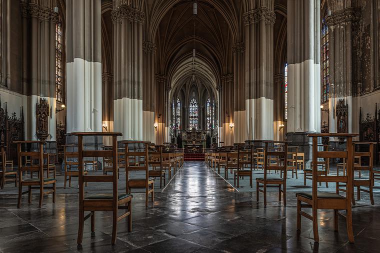 Brussel's Saint Boniface Catholic church interior with chairs and social distancing. Brussel's Saint Boniface Catholic church interior with chairs and social distancing.