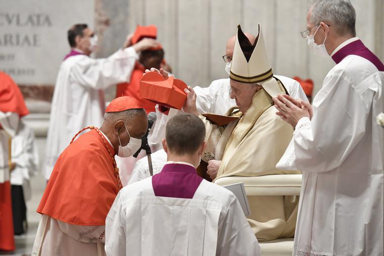 Cardinal Wilton Gregory receives the red hat from Pope Francis in St. Peter's Basilica on Nov. 28. Cardinal Wilton Gregory receives the red hat from Pope Francis in St. Peter's Basilica on Nov. 28.