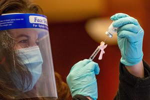 Nurse Laura Bailey draws the Moderna vaccine from the first batch of Moderna's vaccine at Hartford hospital in Hartford, Connecticut on December 21, 2020. Nurse Laura Bailey draws the Moderna vaccine from the first batch of Moderna's vaccine at Hartford hospital in Hartford, Connecticut on December 21, 2020.