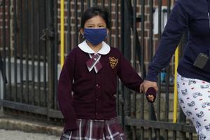 Children arrive for the first day of school at the St. Bartholomew Catholic Academy in the Queens section of New York on September 21, 2020. Children arrive for the first day of school at the St. Bartholomew Catholic Academy in the Queens section of New York on September 21, 2020.
