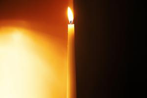 A candle separates dark from light. A candle separates dark from light.