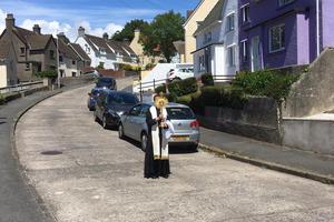 Father Matt Roche-Saunders brings Christ to his parishioners during time of lockdown. Father Matt Roche-Saunders brings Christ to his parishioners during time of lockdown.
