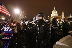 Members of the National Guard and the Washington D.C. police keep a small group of demonstrators away from the Capital after thousands of Donald Trump supporters stormed the United States Capitol building following a "Stop the Steal" rally on January 06, 2021 in Washington, DC. Members of the National Guard and the Washington D.C. police keep a small group of demonstrators away from the Capital after thousands of Donald Trump supporters stormed the United States Capitol building following a "Stop the Steal" rally on January 06, 2021 in Washington, DC.