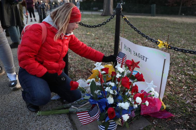 Melody Black, from Minnesota, becomes emotional as she visits a memorial setup near the U.S. Capitol Building for Ashli Babbitt who was killed in the building after a pro-Trump mob broke in on January 07, 2021 in Washington, DC. Melody Black, from Minnesota, becomes emotional as she visits a memorial setup near the U.S. Capitol Building for Ashli Babbitt who was killed in the building after a pro-Trump mob broke in on January 07, 2021 in Washington, DC.