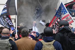 Trump supporters are tear gassed outside the U.S. Capitol in Washington on Jan. 6. Demonstrators breeched security and entered the Capitol as Congress debated the 2020 presidential election Electoral College vote certification. Trump supporters are tear gassed outside the U.S. Capitol in Washington on Jan. 6. Demonstrators breeched security and entered the Capitol as Congress debated the 2020 presidential election Electoral College vote certification.