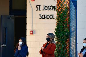 Students attend morning prayers in the courtyard at St. Joseph Catholic School in La Puente, California, on Nov. 16, 2020, where pre-kindergarten to second-grade students in need of special services returned to the classroom for in-person instruction. The campus was the second Catholic school in Los Angeles County to receive a waiver approval to reopen as the coronavirus pandemic raged on. Students attend morning prayers in the courtyard at St. Joseph Catholic School in La Puente, California, on Nov. 16, 2020, where pre-kindergarten to second-grade students in need of special services returned to the classroom for in-person instruction. The campus was the second Catholic school in Los Angeles County to receive a waiver approval to reopen as the coronavirus pandemic raged on.