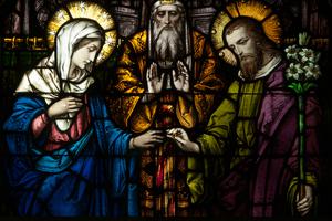 Above, a stained-glass window depicts the betrothal of Mary and Joseph in the Church of the Immaculate Conception in Connellsville, Pennsylvania. Above, a stained-glass window depicts the betrothal of Mary and Joseph in the Church of the Immaculate Conception in Connellsville, Pennsylvania.
