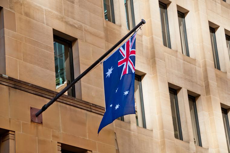 Australian flag hangs from side of building in Sydney. Australian flag hangs from side of building in Sydney.