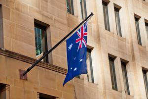 Australian flag hangs from side of building in Sydney. Australian flag hangs from side of building in Sydney.