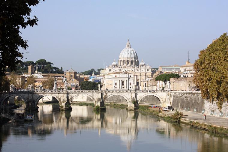 St. Peter’s Basilica is seen across the Tiber River. St. Peter’s Basilica is seen across the Tiber River.
