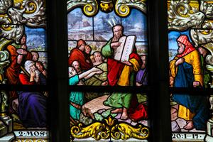 Stained glass window depicting Moses showing the Stone Tablets with the Ten Commandments, in Saint James's Church in Stockholm, Sweden. Stained glass window depicting Moses showing the Stone Tablets with the Ten Commandments, in Saint James's Church in Stockholm, Sweden.