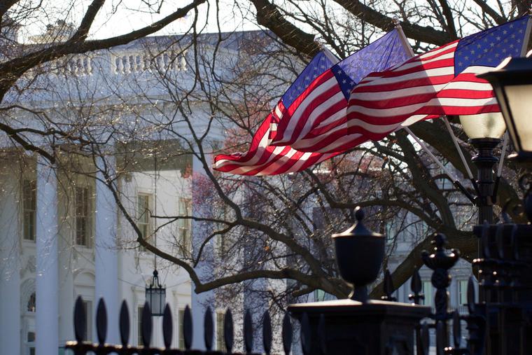 Flags fly outside the White House in Washington, D.C. Flags fly outside the White House in Washington, D.C.