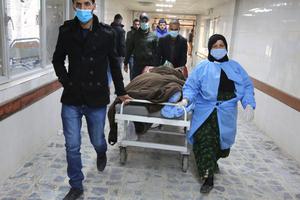 An injured man is rushed to the emergency ward of a hospital following a twin suicide bombing on a bustling commercial street in the heart of the Iraqi capital of Baghdad on Jan. 21. The attack killed at least 32 people and wounded more than 110 others, Iraq's health ministry said. The ministry said the first suicide bomber had rushed into the market and claimed to feel sick, so that people would gather around him. He then detonated his explosives. An injured man is rushed to the emergency ward of a hospital following a twin suicide bombing on a bustling commercial street in the heart of the Iraqi capital of Baghdad on Jan. 21. The attack killed at least 32 people and wounded more than 110 others, Iraq's health ministry said. The ministry said the first suicide bomber had rushed into the market and claimed to feel sick, so that people would gather around him. He then detonated his explosives.