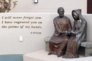 The memorial walls are centered around a life-size bronze statue of St. Joseph and Our Lady of Guadalupe, co-patrons of the unborn. Together they hold an unborn baby in their hands. The memorial walls are centered around a life-size bronze statue of St. Joseph and Our Lady of Guadalupe, co-patrons of the unborn. Together they hold an unborn baby in their hands.
