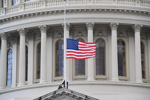 A U.S. flag is raised after the inauguration of Joe Biden as the 46th U.S. president on Jan. 20 at the U.S. Capitol in Washington. A U.S. flag is raised after the inauguration of Joe Biden as the 46th U.S. president on Jan. 20 at the U.S. Capitol in Washington.