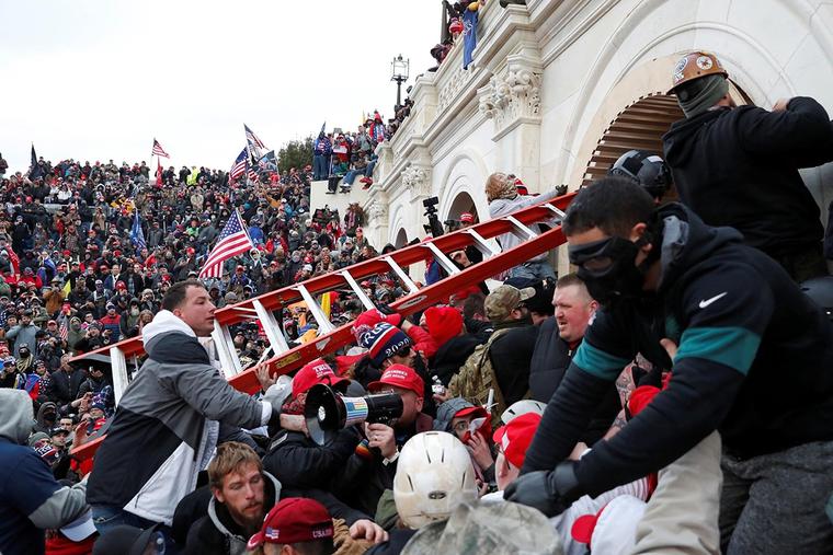 A mob storms the U.S. Capitol on Jan. 6. A mob storms the U.S. Capitol on Jan. 6.