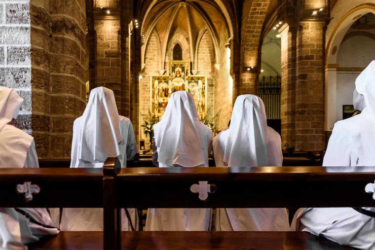 Nuns pray together in front of the Blessed Sacrament. Nuns pray together in front of the Blessed Sacrament.