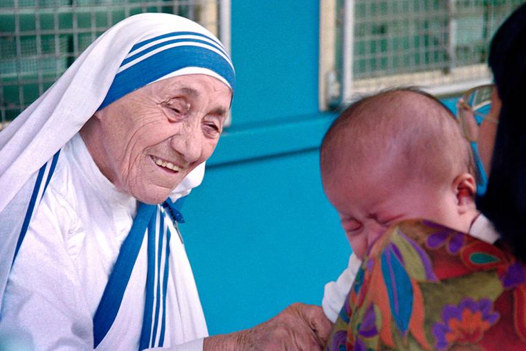 St. Teresa of Calcutta greets a child at the Gift of Love Home on Oct. 20, 1993, in Singapore. St. Teresa of Calcutta greets a child at the Gift of Love Home on Oct. 20, 1993, in Singapore.