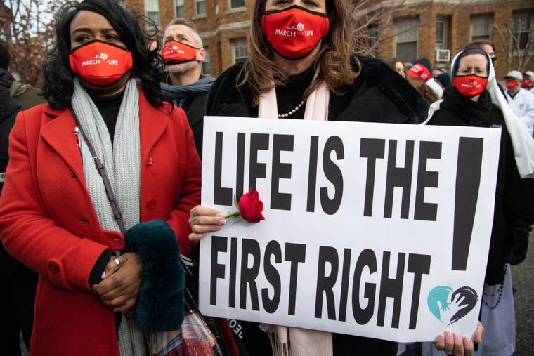 Members of the pro-life community participate in the "March for Life," an annual event to mark the anniversary of the 1973 Supreme Court case Roe v. Wade, which legalized abortion in the US, outside the US Supreme Court in Washington, DC, January 29, 2021. Members of the pro-life community participate in the "March for Life," an annual event to mark the anniversary of the 1973 Supreme Court case Roe v. Wade, which legalized abortion in the US, outside the US Supreme Court in Washington, DC, January 29, 2021.