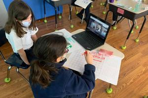 Students at St. Rita School in Webster, New York, make use of digital technology that connects in-person learners with their distance-learning peers. Students at St. Rita School in Webster, New York, make use of digital technology that connects in-person learners with their distance-learning peers.