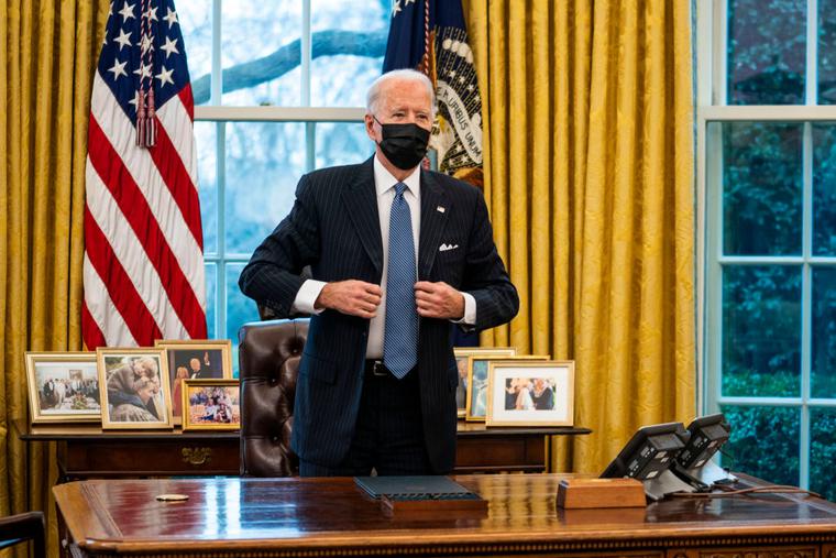 President Joe Biden stands after signing an executive order in the Oval Office of the White House on January 25, 2021 in Washington, DC. President Biden signed an executive order repealing the ban on transgender people serving openly in the military. President Joe Biden stands after signing an executive order in the Oval Office of the White House on January 25, 2021 in Washington, DC. President Biden signed an executive order repealing the ban on transgender people serving openly in the military.