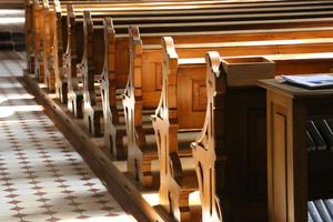 Pews inside Catholic church. Pews inside Catholic church.
