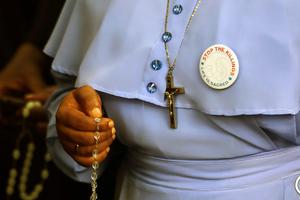 A Catholic sister holding a rosary attends a march on the streets of Abuja, Nigeria, on March 1, 2020, after the Catholic bishops of that nation called for prayer and penance for peace and protection against the murder and kidnapping of Christians by the Boko Haram insurgents. A Catholic sister holding a rosary attends a march on the streets of Abuja, Nigeria, on March 1, 2020, after the Catholic bishops of that nation called for prayer and penance for peace and protection against the murder and kidnapping of Christians by the Boko Haram insurgents.