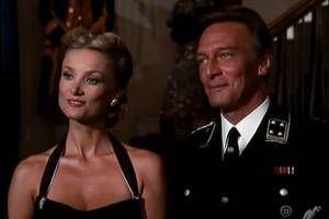 Christopher Plummer stands next to Barbara Bouchet in a scene of ‘The Scarlet and the Black’ (1983). Christopher Plummer stands next to Barbara Bouchet in a scene of ‘The Scarlet and the Black’ (1983).
