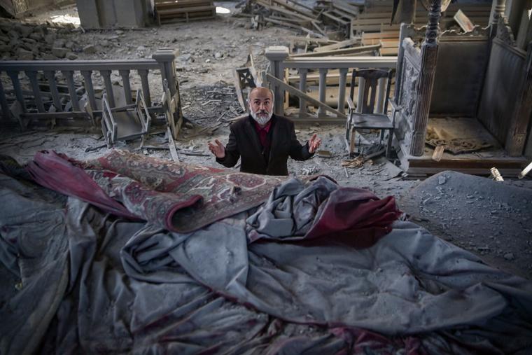 Arthur Sahakyan, 63, prays inside the damaged Ghazanchetsots (Holy Saviour) Cathedral in the historic city of Shusha, some 15 kilometers from the disputed Nagorno-Karabakh province's capital Stepanakert, that was hit by a bomb during the fighting between Armenia and Azerbaijan over the breakaway region, on October 13, 2020. Arthur Sahakyan, 63, prays inside the damaged Ghazanchetsots (Holy Saviour) Cathedral in the historic city of Shusha, some 15 kilometers from the disputed Nagorno-Karabakh province's capital Stepanakert, that was hit by a bomb during the fighting between Armenia and Azerbaijan over the breakaway region, on October 13, 2020.