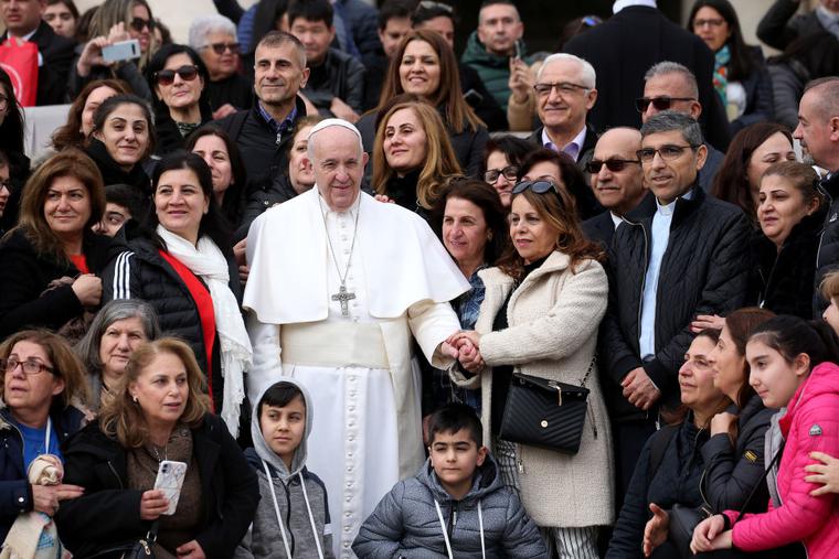 Pope Francis poses with faithful from Iraq in St. Peter's Square during his weekly audience on February 26, 2020 in Vatican City, Vatican. Pope Francis poses with faithful from Iraq in St. Peter's Square during his weekly audience on February 26, 2020 in Vatican City, Vatican.