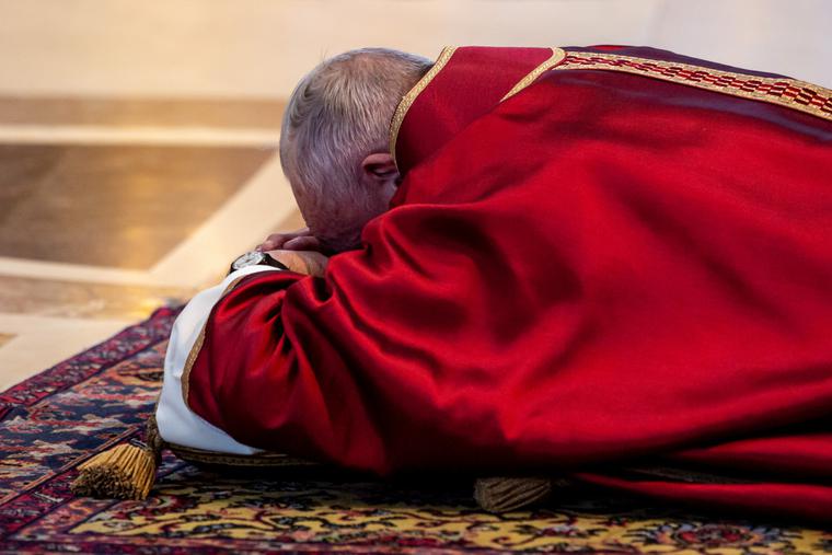 Pope Francis venerates the Cross during the liturgy for the Lord's Passion in St. Peter's Basilica on Good Friday. Pope Francis venerates the Cross during the liturgy for the Lord's Passion in St. Peter's Basilica on Good Friday.
