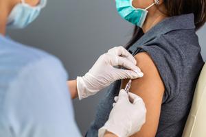An employee receives the COVID vaccine. An employee receives the COVID vaccine.