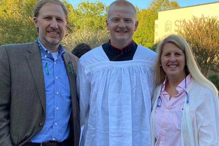 Seminarian John Cuppett is shown with his parents. Seminarian John Cuppett is shown with his parents.
