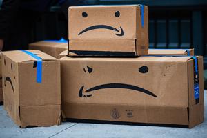 Cardboard boxes made to resemble Amazon packages are seen during a labor protest outside the home of Amazon CEO Jeff Bezos in New York on Dec. 2. Cardboard boxes made to resemble Amazon packages are seen during a labor protest outside the home of Amazon CEO Jeff Bezos in New York on Dec. 2.