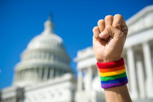 A LGBT activist outside the United States Capitol building and Supreme Court. A LGBT activist outside the United States Capitol building and Supreme Court.