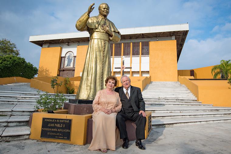 A couple sits together in front of a statue of Pope St. John Paul II at Maria Auxiliadora church in Monterrey, Mexico, on Jan. 18, 2020 — their 50th wedding anniversary. A couple sits together in front of a statue of Pope St. John Paul II at Maria Auxiliadora church in Monterrey, Mexico, on Jan. 18, 2020 — their 50th wedding anniversary.