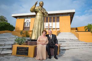 A couple sits together in front of a statue of Pope St. John Paul II at Maria Auxiliadora church in Monterrey, Mexico, on Jan. 18, 2020 — their 50th wedding anniversary. A couple sits together in front of a statue of Pope St. John Paul II at Maria Auxiliadora church in Monterrey, Mexico, on Jan. 18, 2020 — their 50th wedding anniversary.