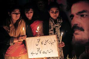 Pakistani civil rights activists gather during a ceremony on the site of the attack on slain Pakistani minority affairs minister Shahbaz Bhatti in Islamabad on March 3, 2011. Pakistan announced three days of national mourning and vowed "fool-proof" security after a Christian government minister who decried Islamic blasphemy laws was gunned down. Pakistani civil rights activists gather during a ceremony on the site of the attack on slain Pakistani minority affairs minister Shahbaz Bhatti in Islamabad on March 3, 2011. Pakistan announced three days of national mourning and vowed "fool-proof" security after a Christian government minister who decried Islamic blasphemy laws was gunned down.