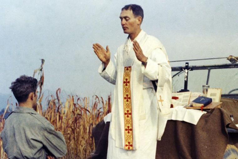 Father Emil Kapaun celebrates Mass using the hood of a Jeep as his altar, on Oct. 7, 1950. Father Emil Kapaun celebrates Mass using the hood of a Jeep as his altar, on Oct. 7, 1950.