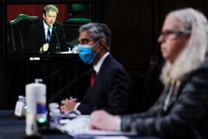 US Senator Rand Paul (on screen), Republican of Kentucky, questions Vivek Murthy (C), nominee for US Surgeon General, and Rachel Levine (R), nominee for Assistant Secretary of Health and Human Services, during a Senate Health, Education, Labor, and Pensions Committee nomination hearing on Capitol Hill in Washington, DC, on February 25, 2021. US Senator Rand Paul (on screen), Republican of Kentucky, questions Vivek Murthy (C), nominee for US Surgeon General, and Rachel Levine (R), nominee for Assistant Secretary of Health and Human Services, during a Senate Health, Education, Labor, and Pensions Committee nomination hearing on Capitol Hill in Washington, DC, on February 25, 2021.