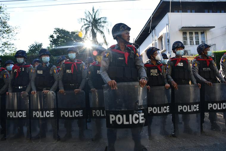 Police create a barrier during protests in Burma. Police create a barrier during protests in Burma.
