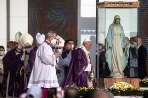 Pope Francis walks towards a statue that was rescued from a church destroyed by ISIS in the village of Karemlash while conducting a mass at the Franso Hariri Stadium on March 07, 2021 in Erbil, Iraq. Pope Francis walks towards a statue that was rescued from a church destroyed by ISIS in the village of Karemlash while conducting a mass at the Franso Hariri Stadium on March 07, 2021 in Erbil, Iraq.