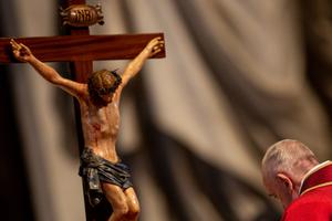 Pope Francis venerates the Cross during the liturgy for the Lord's Passion in St. Peter's Basilica on Good Friday.